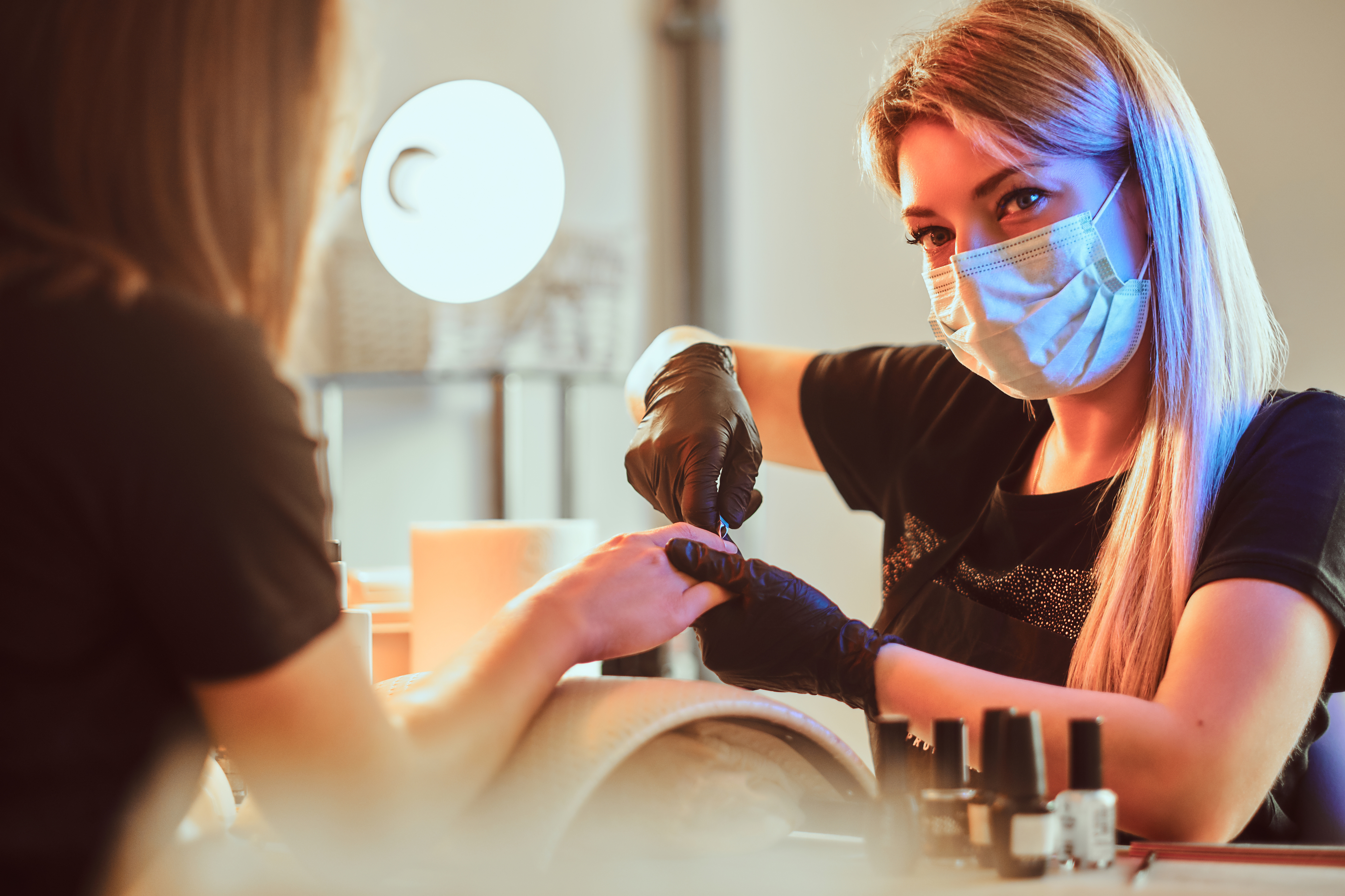 Women Manicurist at Work with Client